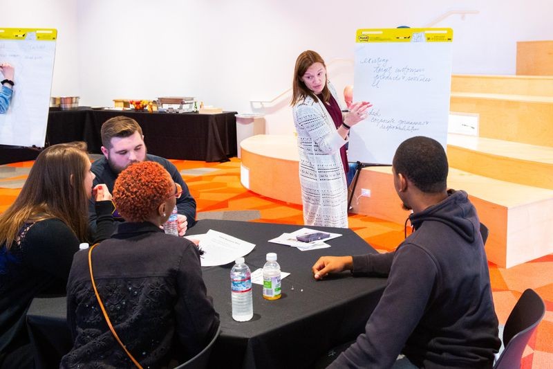 Students analyze business plans for Apple and Intel in the CHM's Learning Lab.